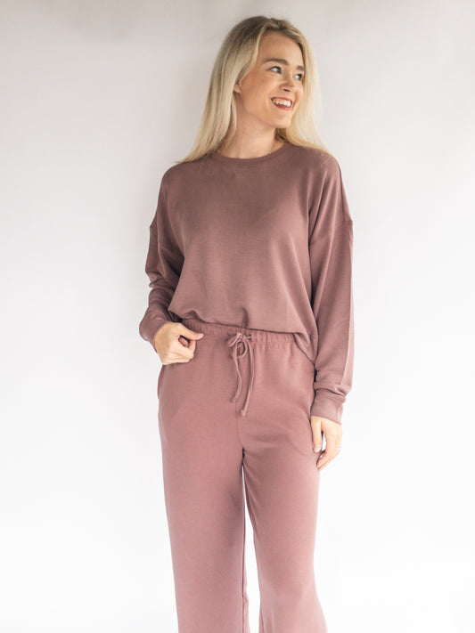 woman wearing modal lounge set pajamas comfortable with pockets rose taupe color