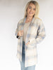 Cozy Checker Sweater long Cardigan with plaid detailing over a beige tank top with judy blue high rise jeans