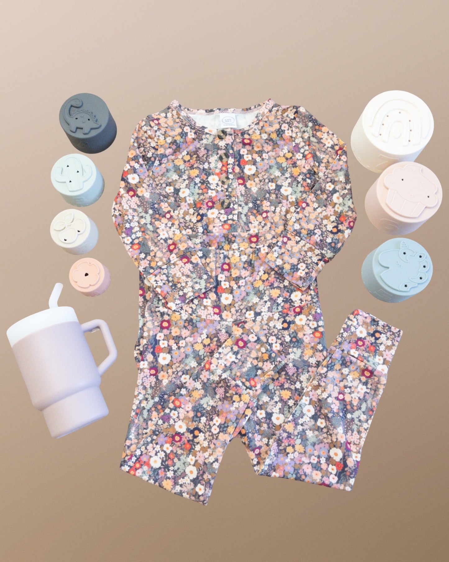 Toddler 12-24m gift set bundle that includes a lou lou & company Gracie Top + Bottom outfit, silicone pink tumbler, and silicone stacking cup toys.