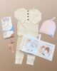 Scout Lou Lou Top + Bottom set, copper pearl luna swaddle blanket, crinkle book, koala teether.
